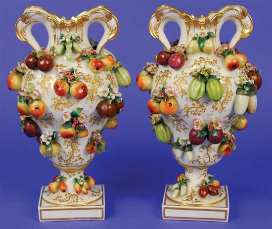 Appraisal: PAIR OF FRENCH PORCELAIN FLOWER AND FRUIT ENCRUSTED VASES Jacob