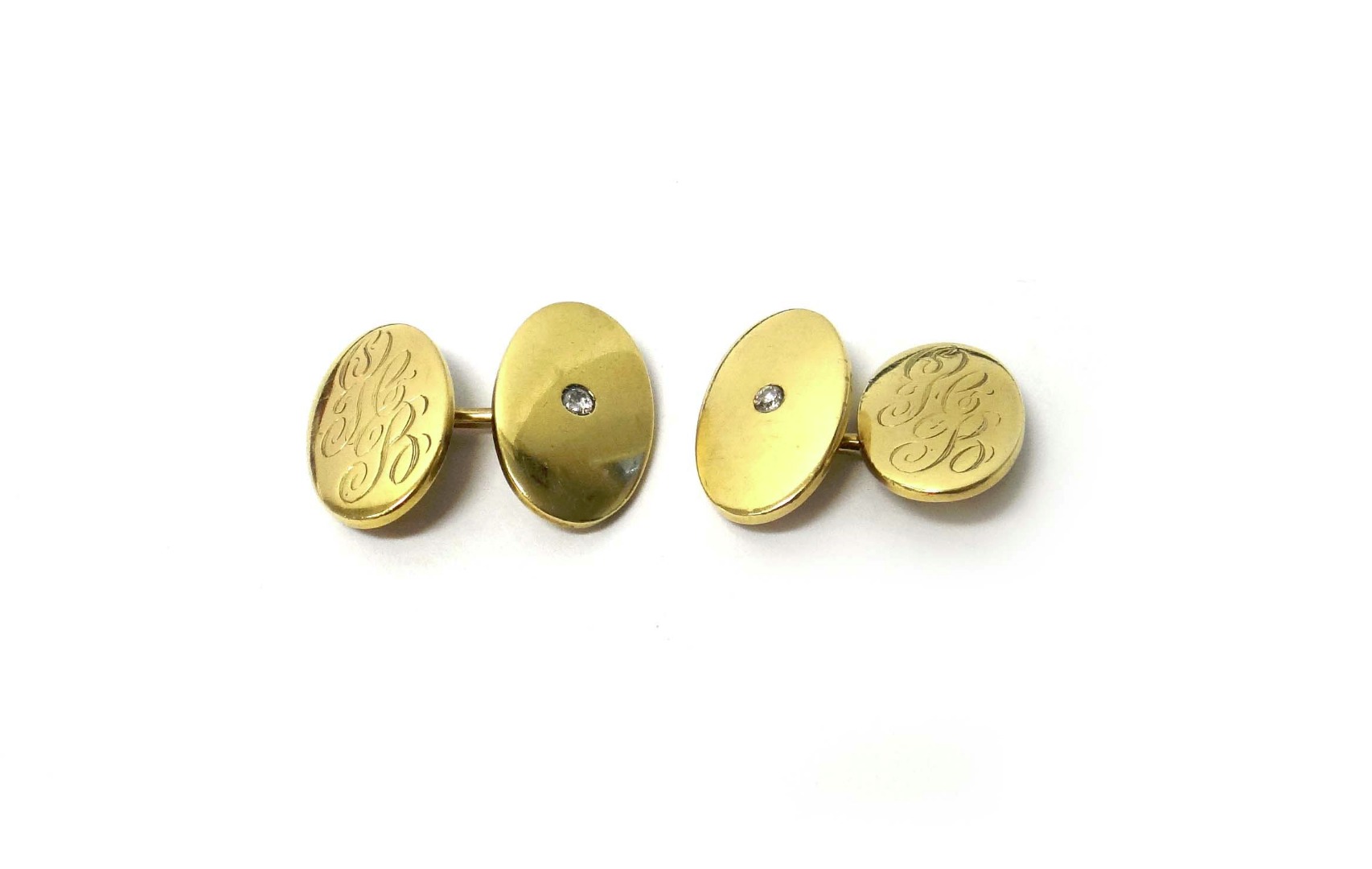 Appraisal: A pair of gold and diamond set cufflinks with oval