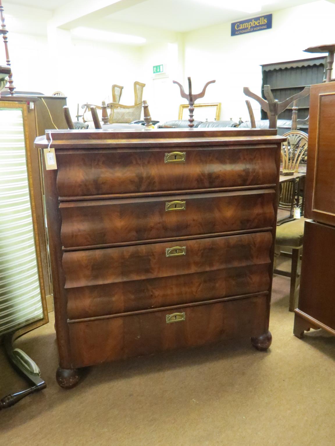 Appraisal: An early th century continental mahogany chest quarter-veneered top above