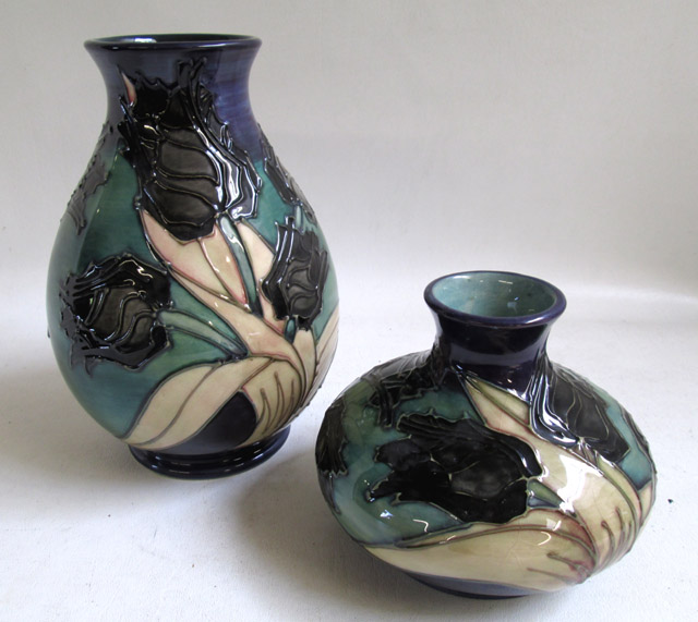 Appraisal: TWO MOORCROFT POTTERY VASES hand painted under glaze in a