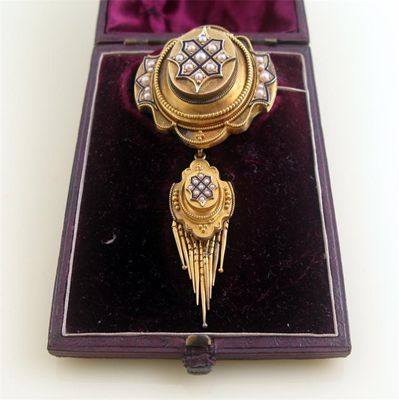 Appraisal: A cased Victorian gold brooch set with seed pearls glazed