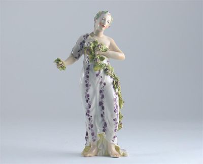 Appraisal: A Kloster-Veilsdorf figure of a bacchante draped with an applied