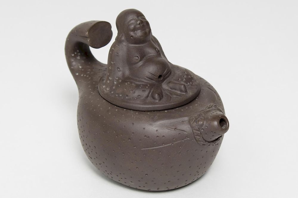 Appraisal: Chinese Yixing Pottery Teapot Seated Budai Chinese Yixing ceramic teapot