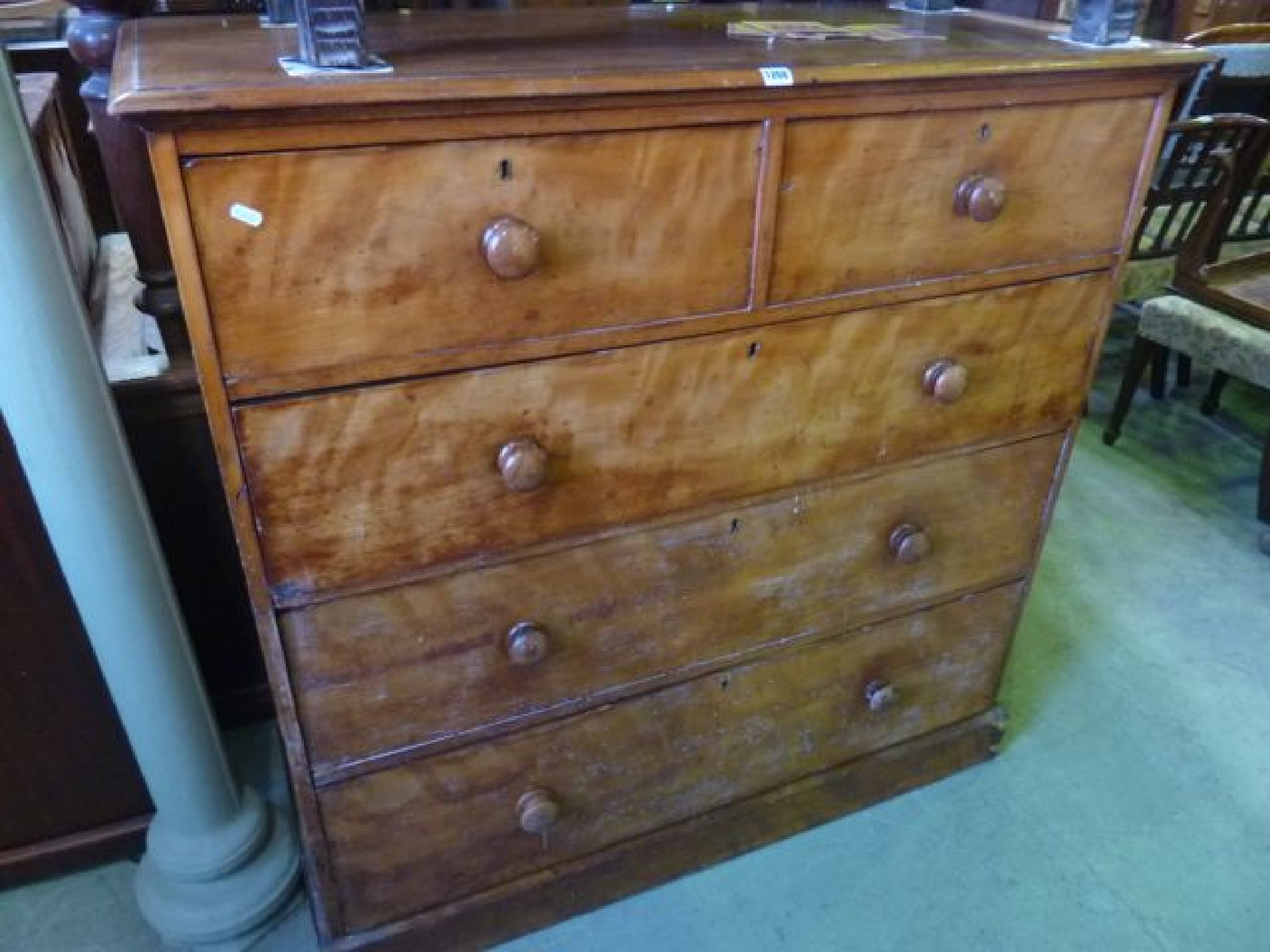 Appraisal: A Victorian satin birch bedroom chest of three long and