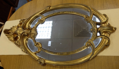 Appraisal: Reproduction rococo mirror in gold x cm