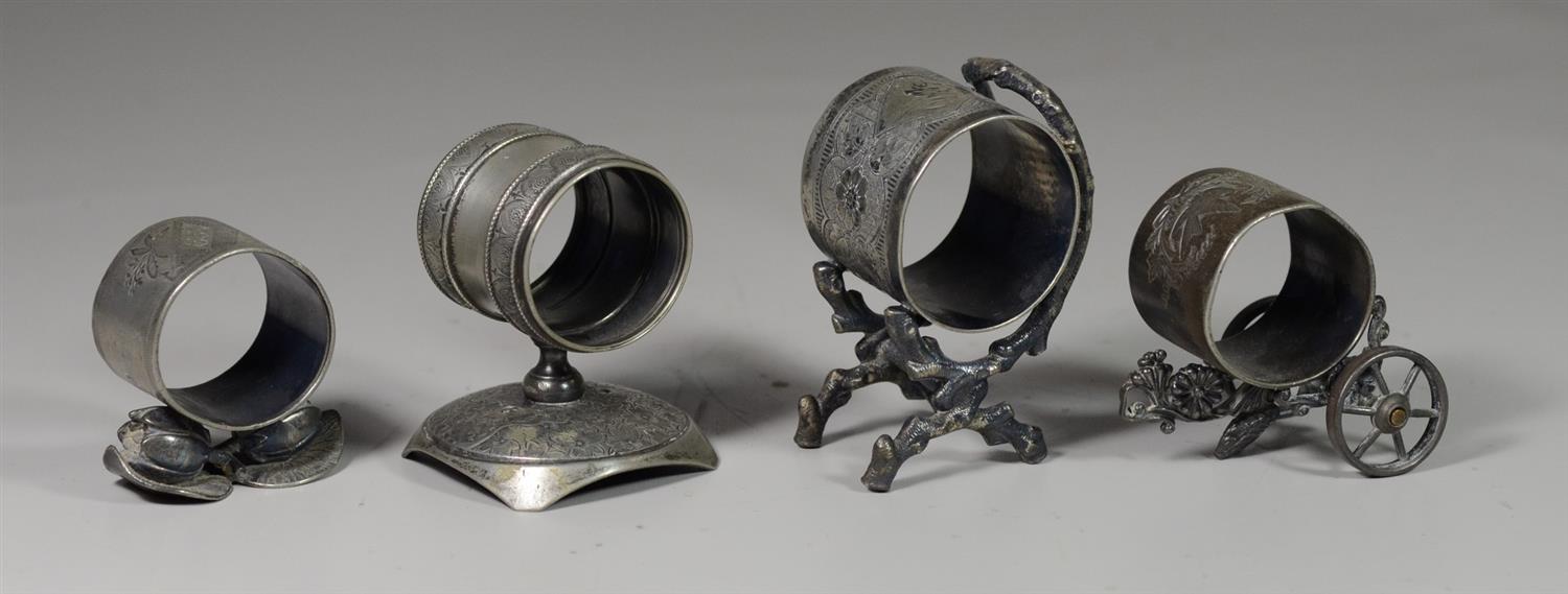 Appraisal: Plated silver napkin rings one on wheels tallest -