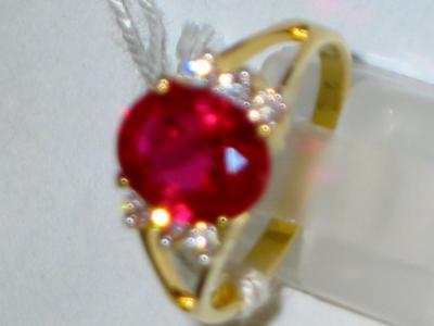 Appraisal: A RUBY AND SAPPHIRE DRESS RING comprising oval ruby with