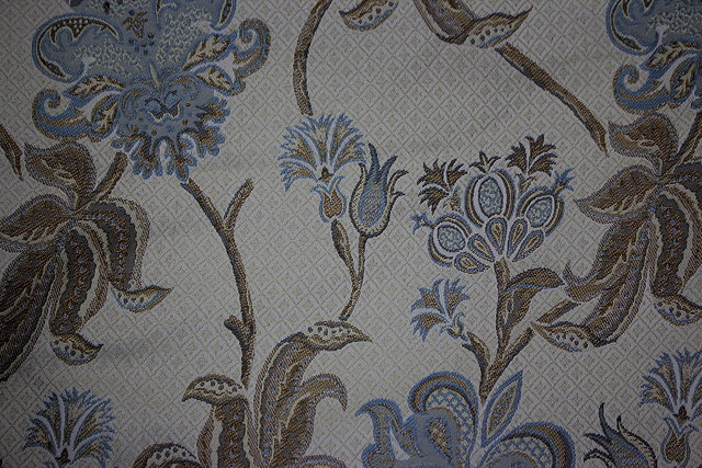 Appraisal: A PAIR OF CREAM GROUND CURTAINS with scrolling acanthus decoration