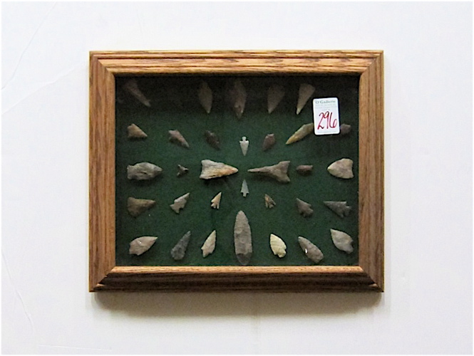 Appraisal: FRAMED ARROW HEADS AND POINTS thirty-four reproductions and Native American