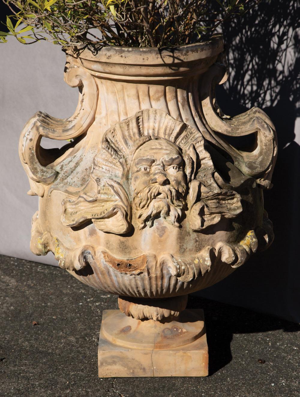 Appraisal: Continental Terracotta Garden Urn centered by a Classical mask swag