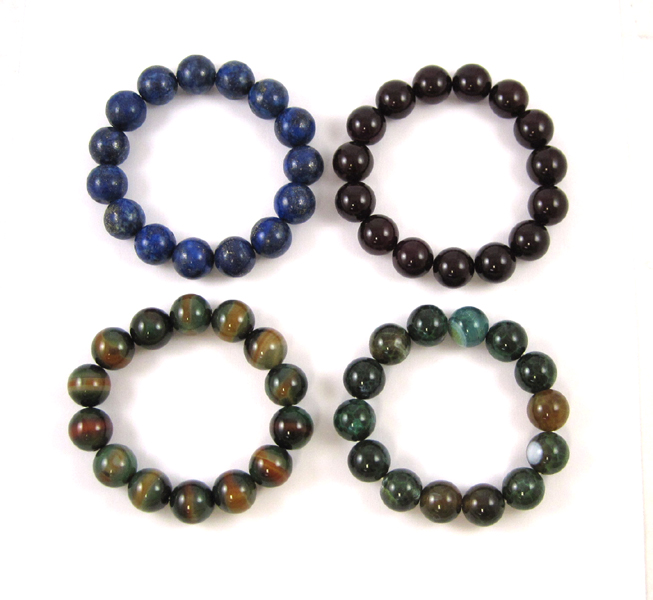 Appraisal: FOUR GEMSTONE STRETCH BRACELETS including two with dragon vein agate