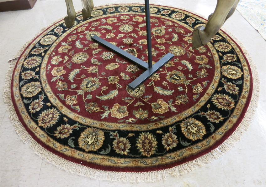 Appraisal: A ROUND ORIENTAL AREA RUG Indo-Persian having a floral decorated