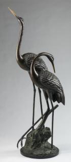 Appraisal: Bronze sculpture of two standing cranes h Patinated bronze sculpture