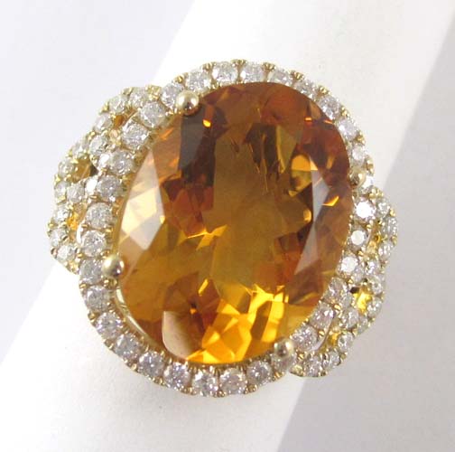 Appraisal: CITRINE DIAMOND AND FOURTEEN KARAT GOLD RING round-cut diamonds are