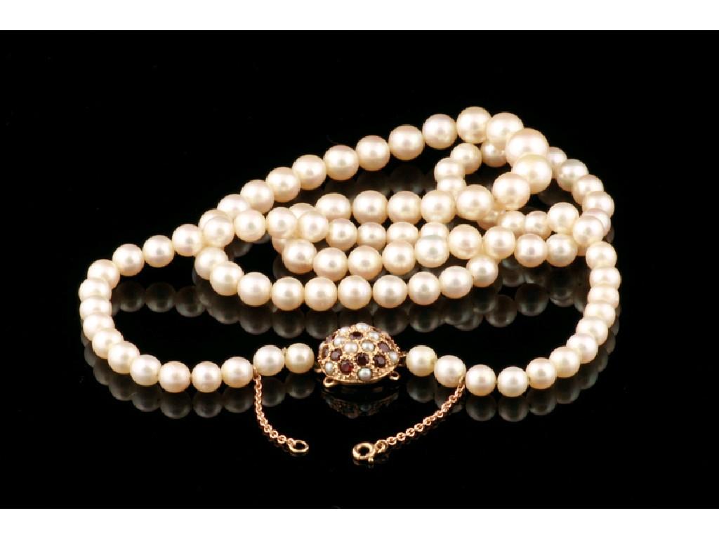 Appraisal: A LONG CULTURED PEARL NECKLACE with a ct yellow gold