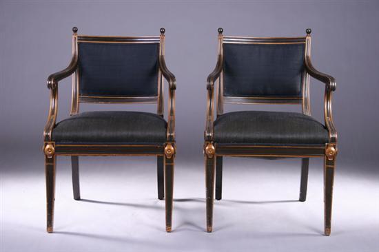 Appraisal: PAIR EMPIRE-STYLE CARVED EBONIZED AND GILT ARMCHAIRS th century Raised