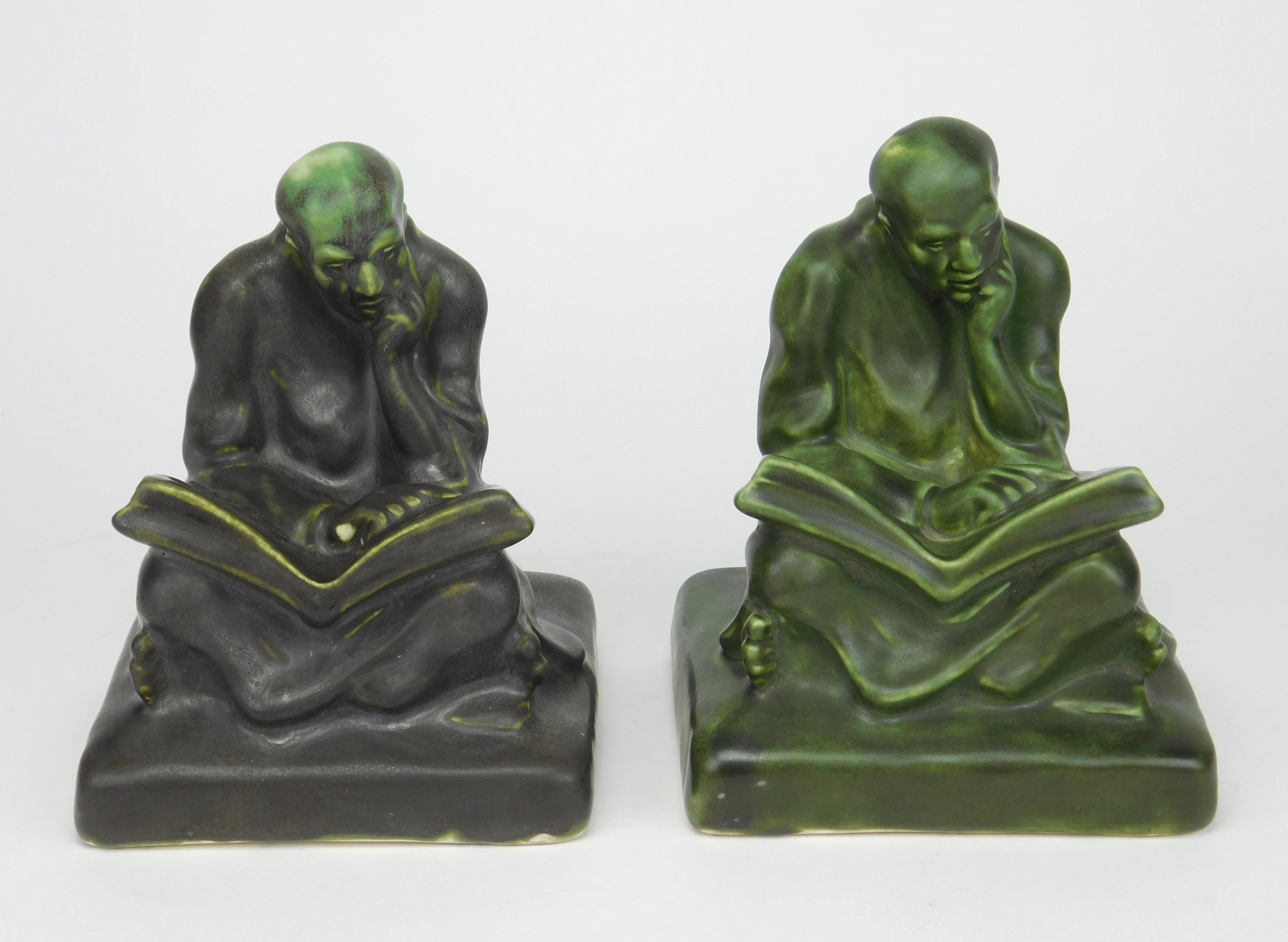 Appraisal: Pair of Cowan pottery bookends mission style Scholar bookends in