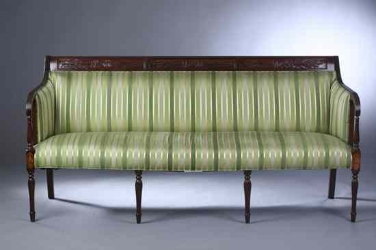 Appraisal: AMERICAN SHERATON STYLE CARVED MAHOGANY SOFA variegated-green silk upholstery Back