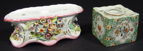 Appraisal: Two th century continental porcelain inkwells one hand painted with