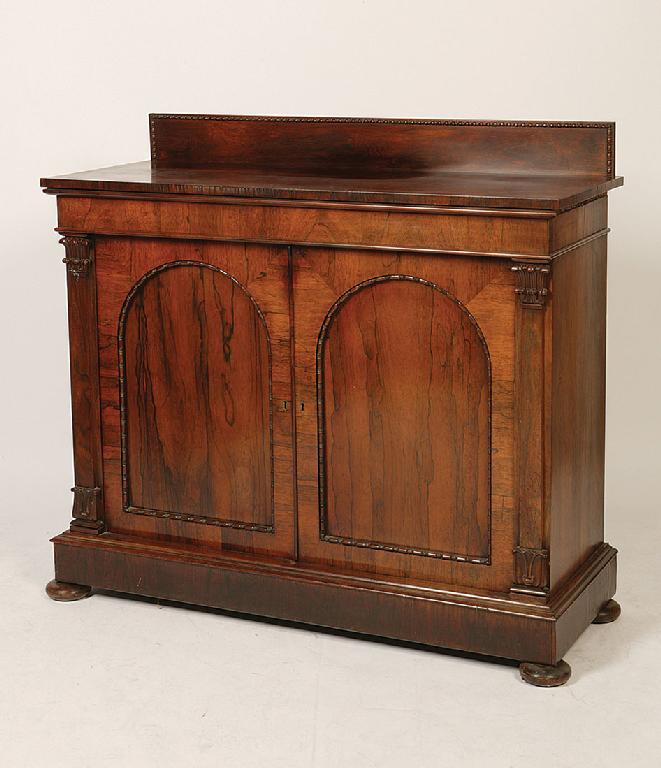 Appraisal: A WILLIAM IV ROSEWOOD CHIFFONIER the rectangular top with a