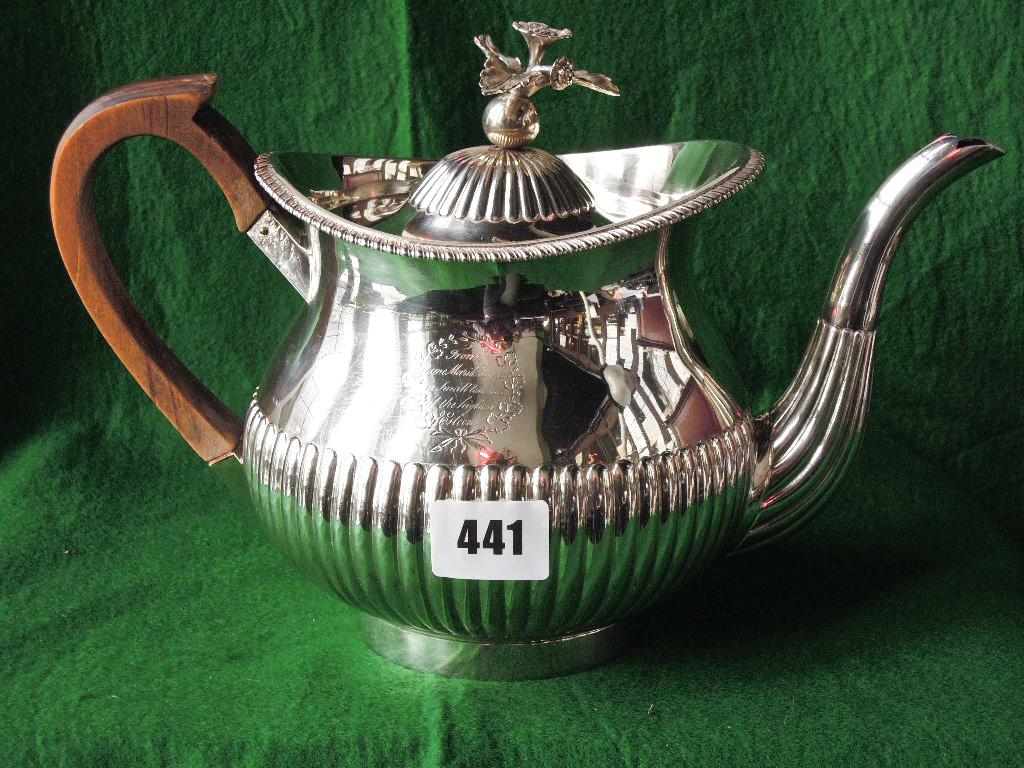 Appraisal: A George III silver teapot with floral finial to the