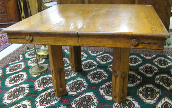 Appraisal: SQUARE OAK DINING TABLE American c the top raised on