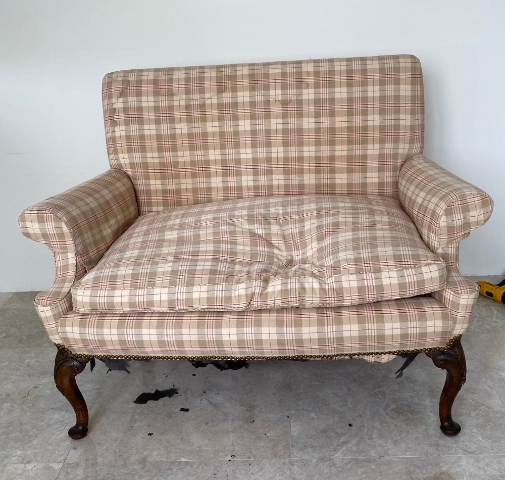 Appraisal: QUEEN ANNE WALNUT UPHOLSTERED SMALL SETTEEThe out-turned scrolled arms centering