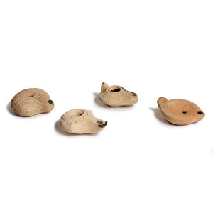 Appraisal: A Group of Four Roman Molded Terra Cotta Oil Lamps