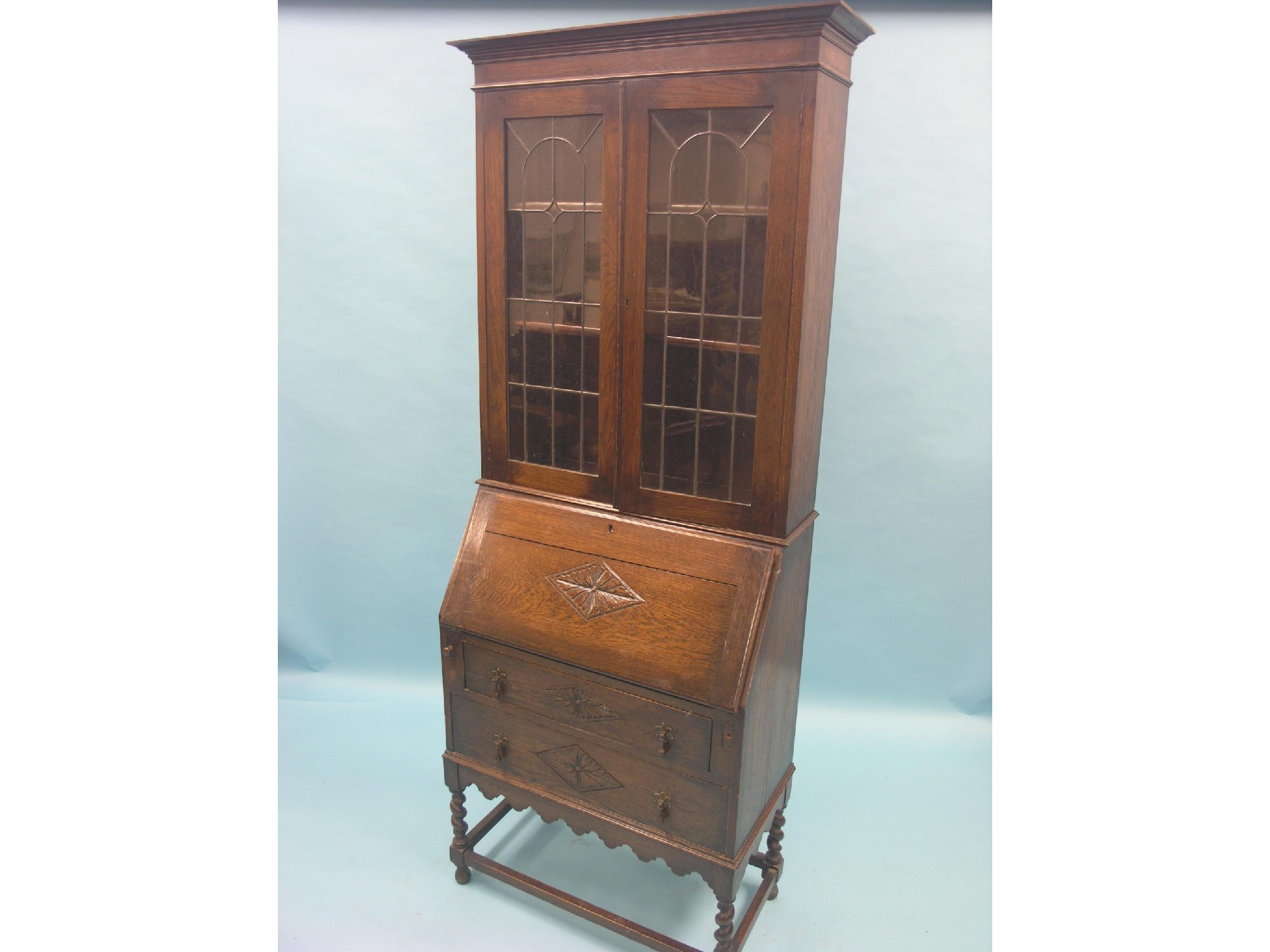 Appraisal: An early th century solid dark oak bureau bookcase pair