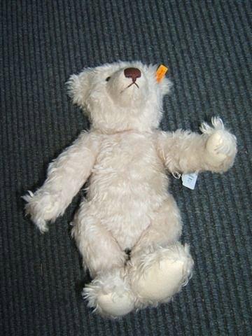 Appraisal: A Steiff white mohair covered teddy bear with brown nose