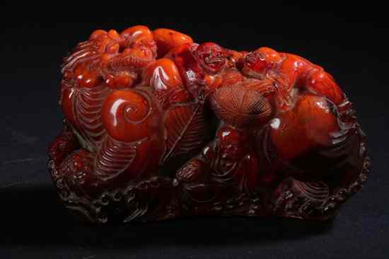 Appraisal: CHINESE AMBER CARVING OF DRAGON GROUP Qing Dynasty Finely carved