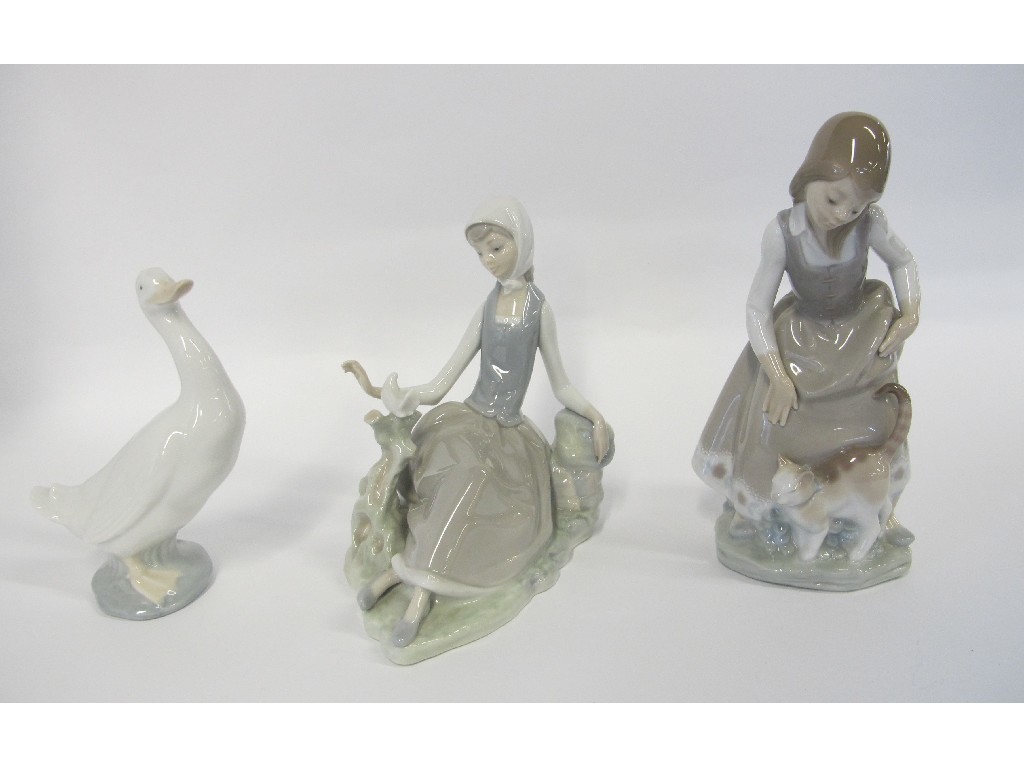 Appraisal: Two Lladro figures of girls and a Nao figure of