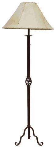 Appraisal: Rustic iron single-light floor lamp th c having laced rawhide