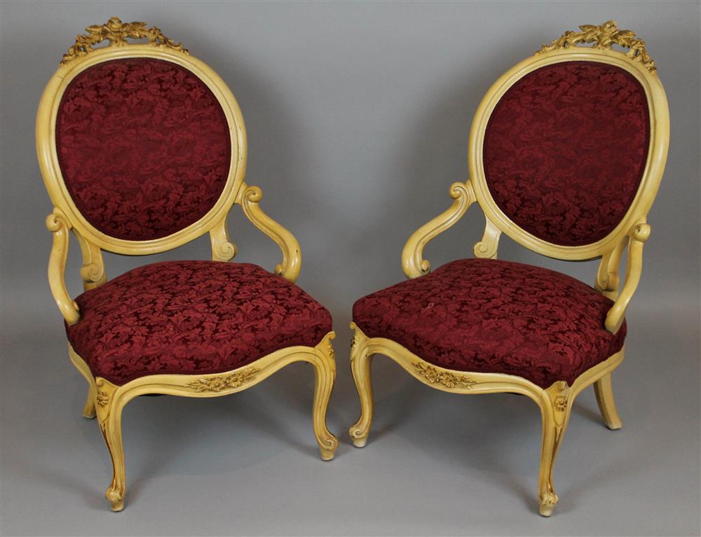 Appraisal: PAIR OF ROCOCO REVIVAL CARVED AND PAINTED OPEN ARM PARLOUR