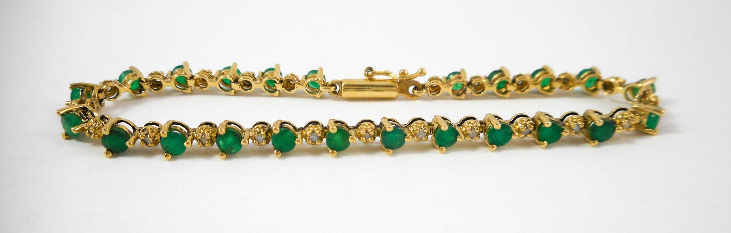 Appraisal: EMERALD AND FOURTEEN KARAT GOLD BRACELET measuring - inches in