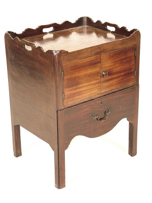 Appraisal: A George III mahogany commode circa the raised gallery above