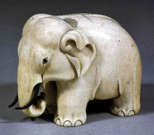 Appraisal: A Chinese carved ivory elephant with gilt metal tusks ins