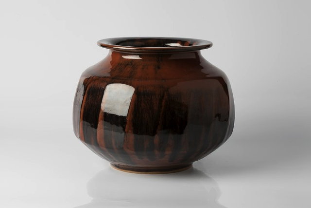 Appraisal: Chris Carter British b Vasewith tenmoku glaze and facetted sidesimpressed