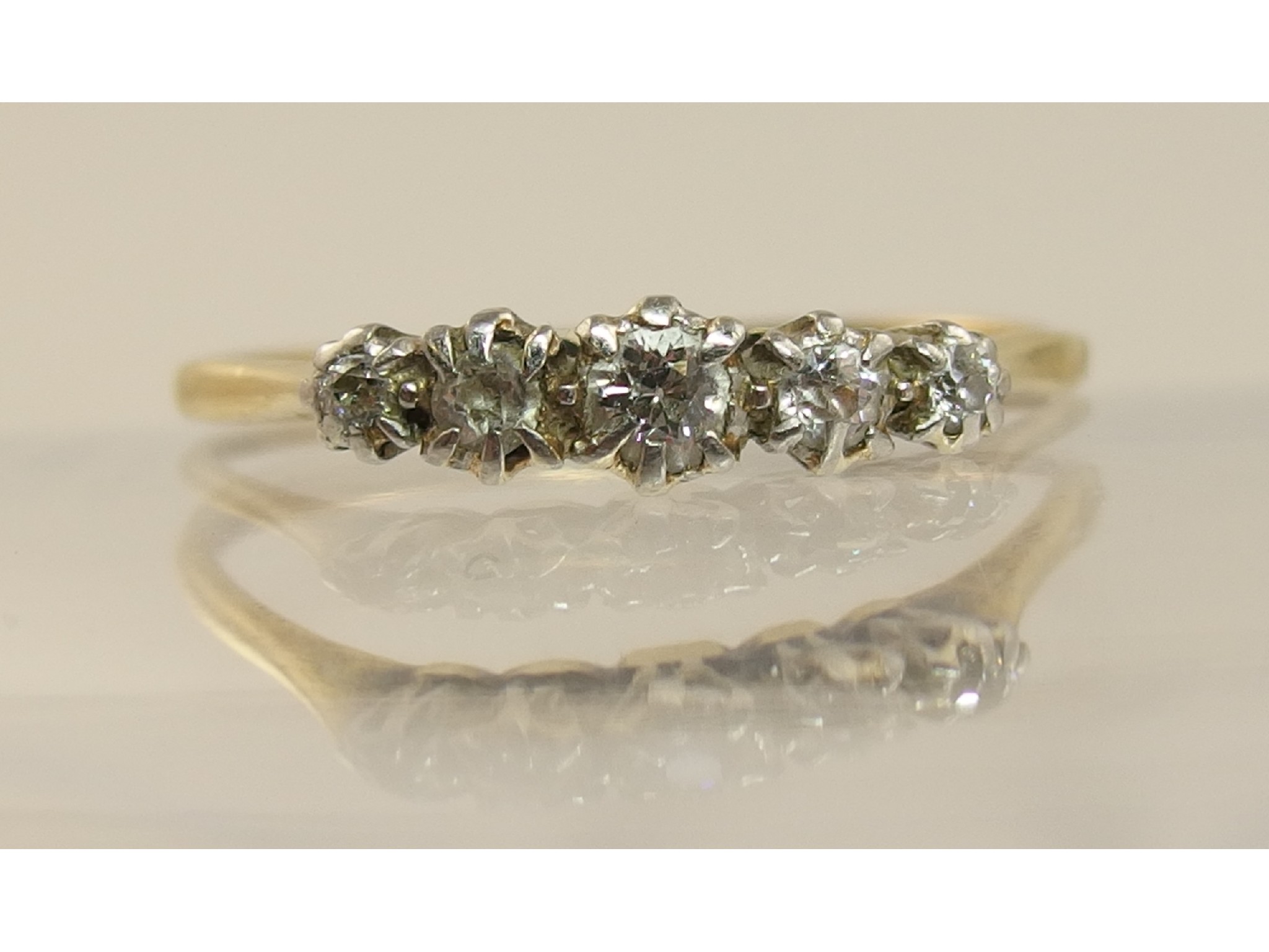 Appraisal: A yellow metal five stone diamond ring of approx cts