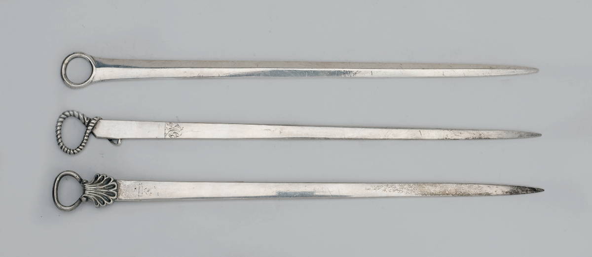 Appraisal: THREE GEORGE III SILVER SKEWERS LONDON THE FIRST CRESTED WILLIAM