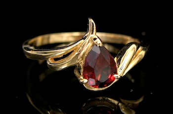 Appraisal: Ladies' Gold Ring Set with Garnet k yellow gold ring