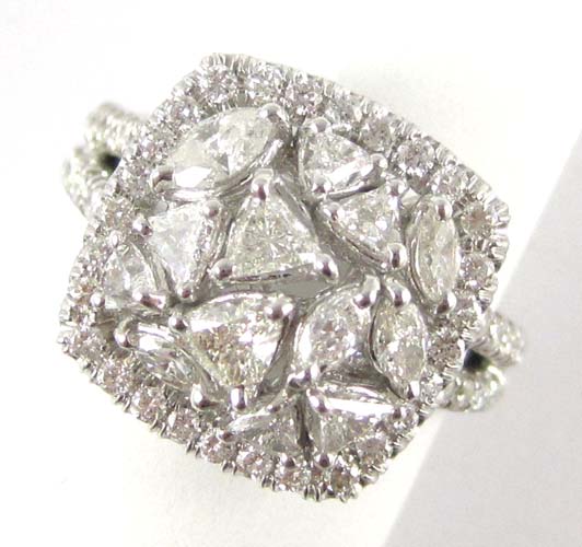 Appraisal: DIAMOND AND EIGHTEEN KARAT WHITE GOLD RING featuring a cluster