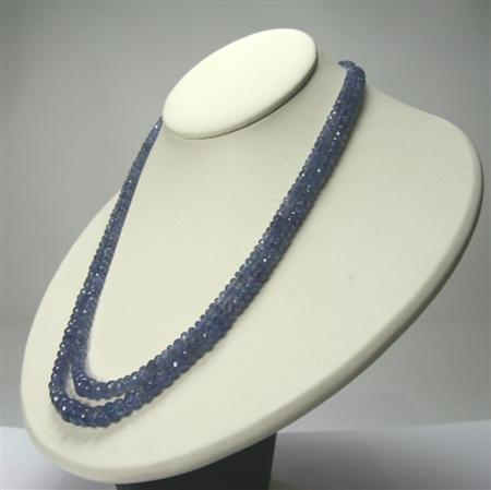 Appraisal: A tanzanite two-row bead necklace composed of graduated faceted cushion