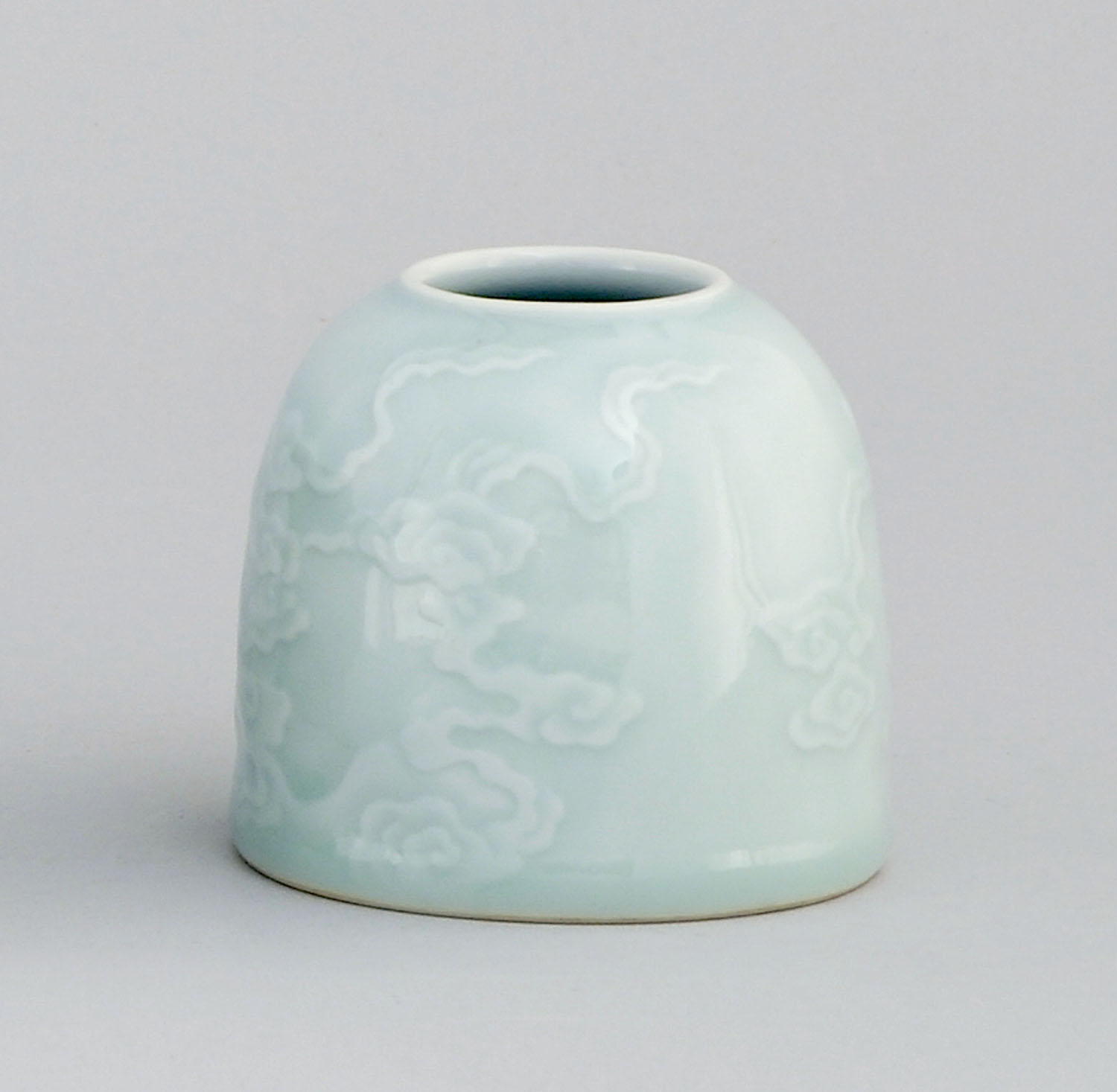 Appraisal: CARVED CELADON PORCELAIN WRITER'S COUPE In beehive form with cloud-like