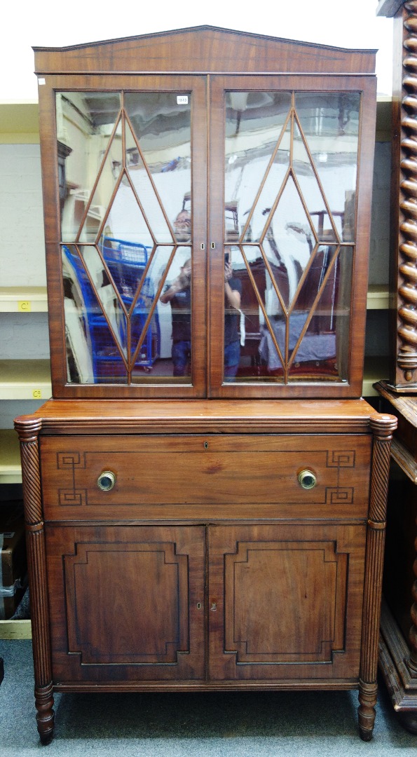 Appraisal: A Regency mahogany secretaire bookcase the pair of astragal glazed