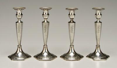 Appraisal: Set of four sterling candlesticks paneled shafts beaded borders Gorham