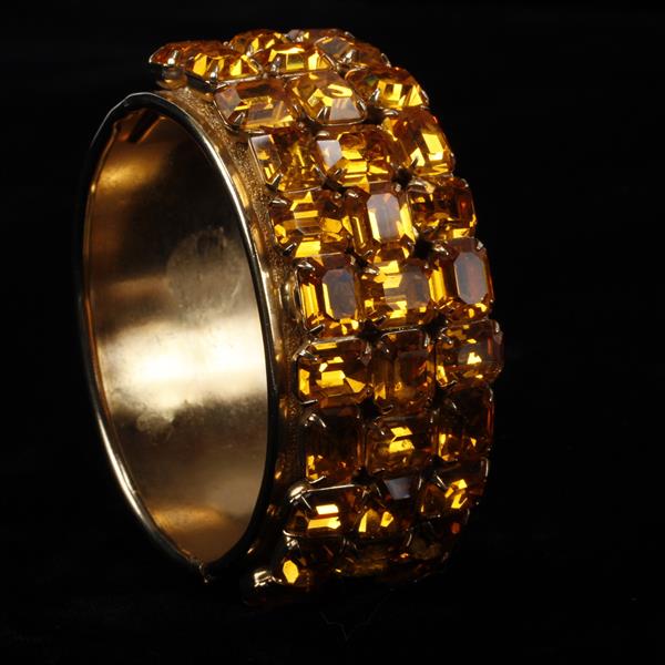 Appraisal: Unmarked Amber Colored Rhinestone Hinged Cuff Bracelet inner width widest