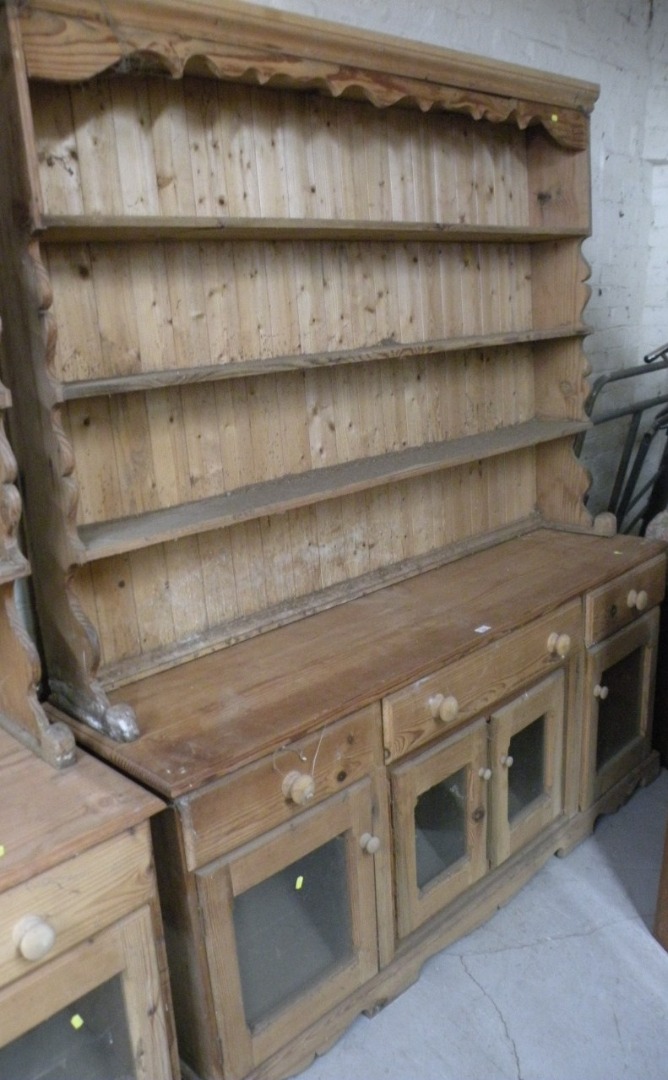 Appraisal: A stripped and lightly polished reclaimed pine dresser the upper