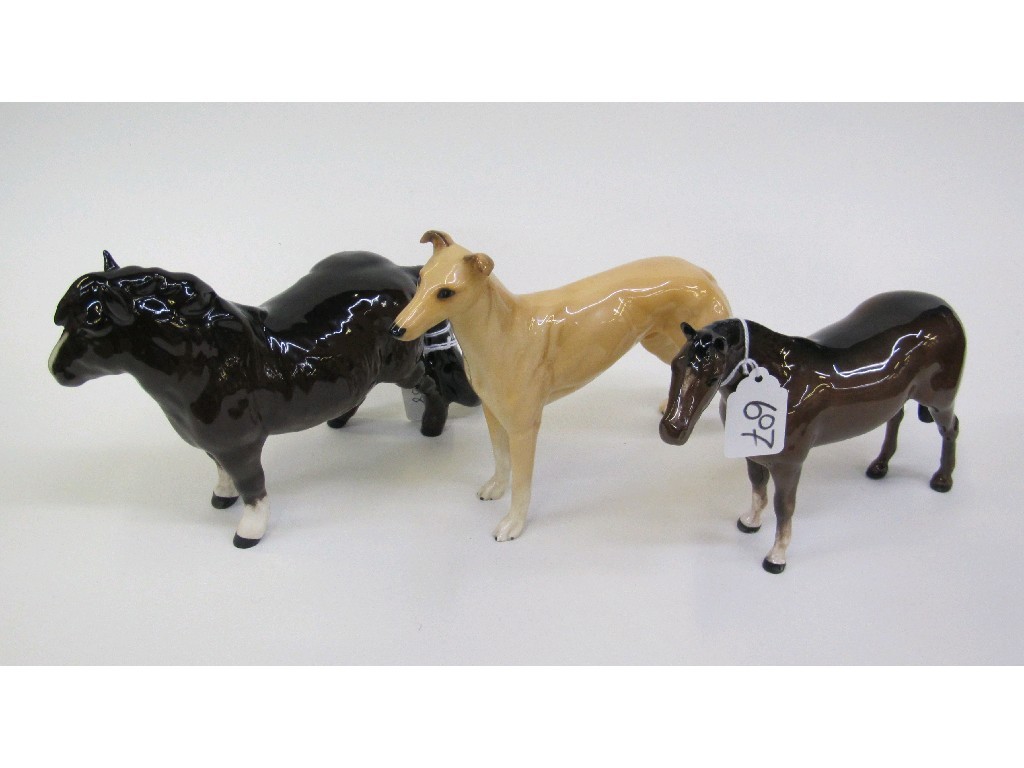 Appraisal: Two Beswick figures to include a horse and greyhound -