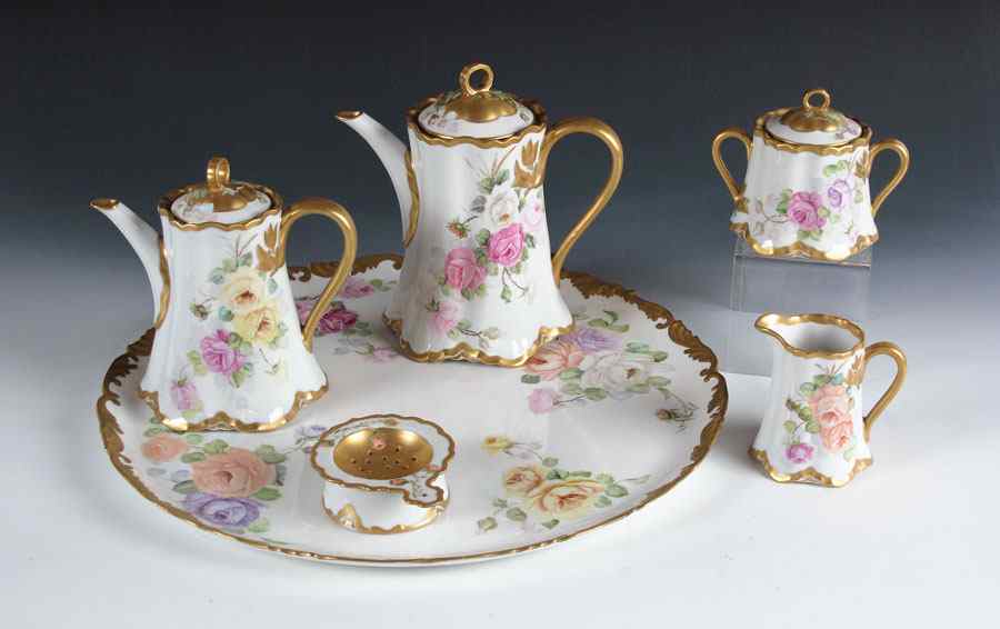 Appraisal: HAND PAINTED PORCELAIN TEA AND COFFEE SET Rose decorated Limoges